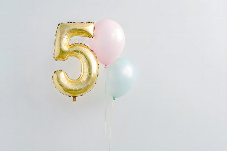 Pastel colors, the letter 5 from a gold foil balloon on a white minimalist background with space for text.の素材