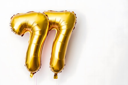 Pastel colors, the letter 77 from a gold foil balloon on a white minimalist background with space for text.の素材