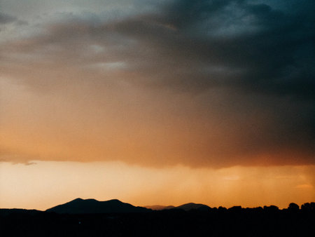 Sunset in the mountains. Colorful sky with clouds at sunset.