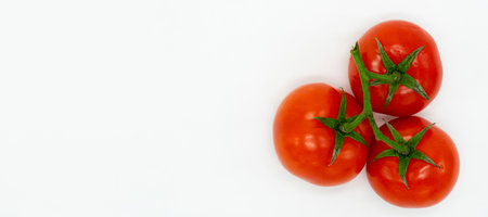 fresh young early tomatoes isolated on a white background with a blank space for your textの写真素材