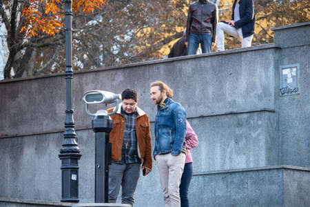 People look at the port in binoculars - Ukraine, Odessa, 11,06,2020のeditorial素材