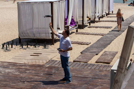 Man launches drone on beach - Ukraine, Odessa, 11,06,2020のeditorial素材