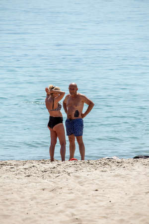 Man and woman aged on the beach - Ukraine, Odessa, 11,06,2020のeditorial素材