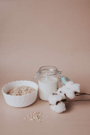 oatmeal and milk on a beige background. Breakfastの写真素材