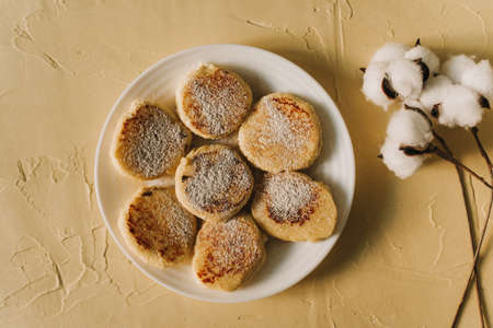 Cottage cheese pancakes or syrniki with on ceramic plate.Delicious breakfast or brunchの写真素材