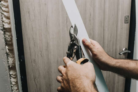 installation of an entrance door. Repair.Plastic cutting
