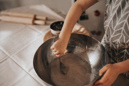 mom and daughter knead dough. Coocingの写真素材