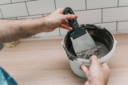 grouting tiles in the kitchen. repair. tile hogの写真素材