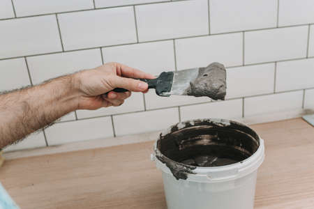 grouting tiles in the kitchen. repair. tile hogの写真素材