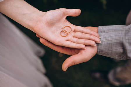 Picture of man and woman with wedding ring.Young married couple holding hands, ceremony wedding day.