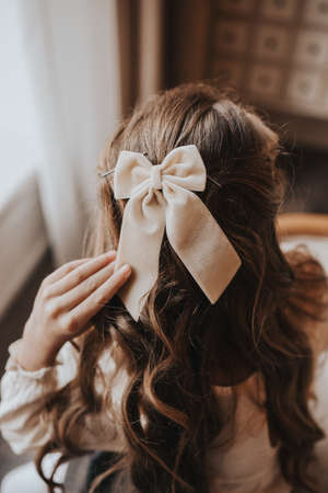 bows on the hair of the girl. girlの写真素材