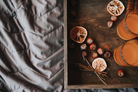 chestnut tray on the bed. Christmas decorations