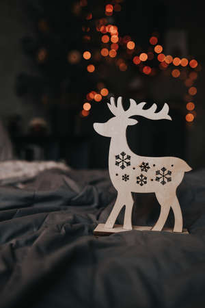 christmas decoration wooden deer on dark backgroundの写真素材