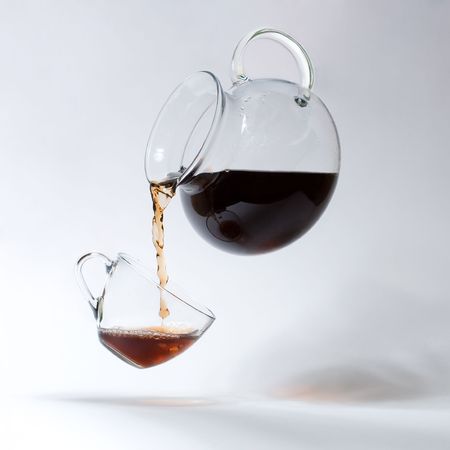 A teacup and a teapot with  teaの写真素材