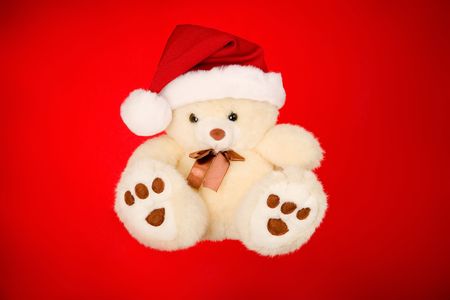 Teddy bear on isolated over red backgroundの写真素材