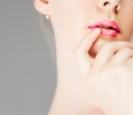 female fingers and lipsの写真素材