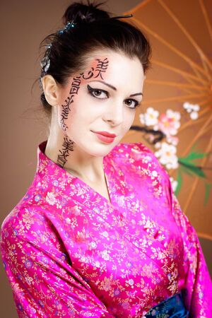 Geisha with umbrellaの写真素材