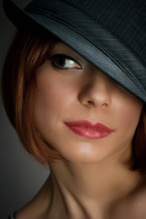 portrait of attractive elegant sexy woman with black hat - retro の写真素材