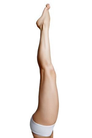 Beautiful naked woman legs pointing up  for your designの写真素材