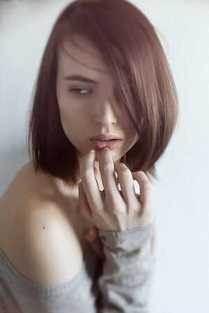 Portrait of beautiful young girl with naked shoulder