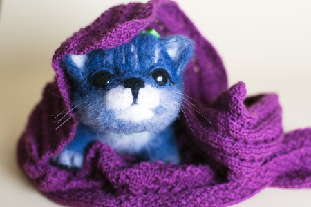Funny handmade felt cat. Cute kitten toyの写真素材