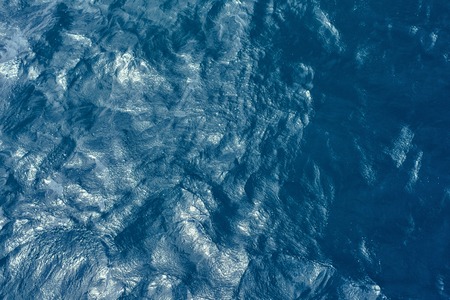 Deep blue water background in blue - just waves.