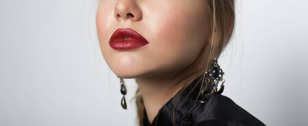 Young woman with beautiful lips. Close-upの写真素材