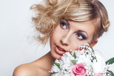 Emotional portrait of beauty woman with bridal bouquetの写真素材