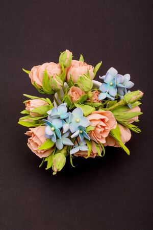 Small bouquet of flowers on dark backgroundの写真素材