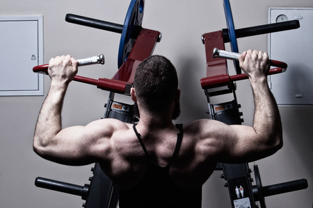 bodybuilder with a beard in the gym