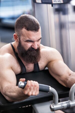 bodybuilder with a beard in the gym