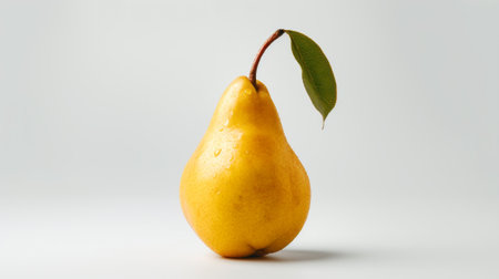 Ripe yellow pear on a white background. The concept of healthy eating.の素材