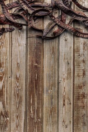 Dry the pods of acacia on an old wooden vintage background. Acacia seeds. Natural wood. Wood boards. The view from the top. Space for text.の写真素材