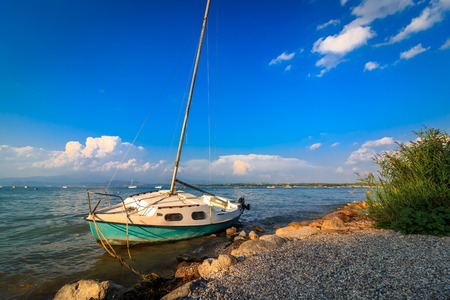 Sailboat on the beach of Peschiera del Garda, Italyの写真素材