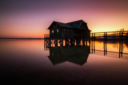 Boathouse in Stegen at the Ammersee at sunset in Bavaria Germanyの写真素材