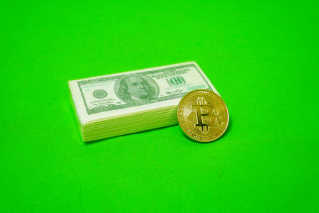 Bitcoin and US Dollar isolated on green background