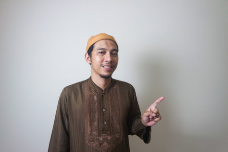 Asian Muslim Man Pointing with Fingers