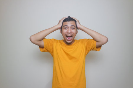 man suffering from headache or thinking over white background
