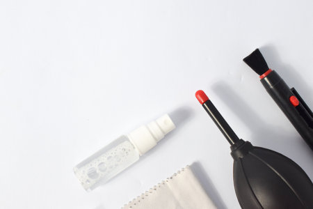 Cleaning set for camera air blower, microfiber, brush and more. Isolated on white backgroundの写真素材