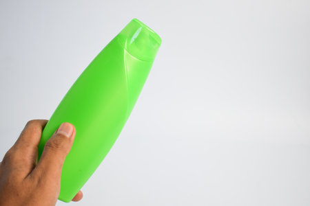 Green blank bottle shampoo minimalist bakcground, hair care bottle mock up product.の写真素材