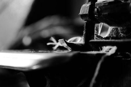Vintage Black and White Close up Serger or Overlock Machine with threads, vintage black and white...