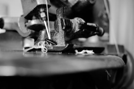 Vintage Black and White Close up Serger or Overlock Machine with threads, vintage black and white...