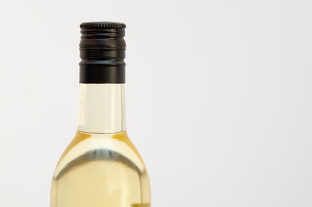 Sealed glass of liquid with a black metal cupの写真素材