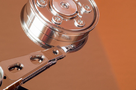 Lateral abstract shot of hard drive reading head and rotor