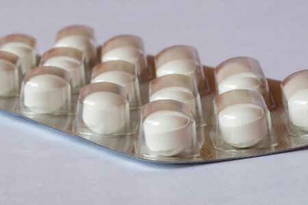 Lateral view of a pill box containing pills