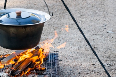 Fire burning under the cauldronの写真素材