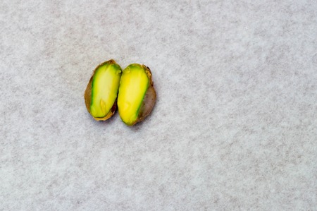Pistachio nut inside in halfの写真素材