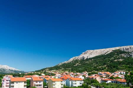 Holiday houses under a hillの写真素材