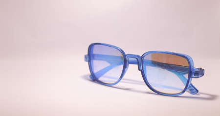 glasses on a blue backgroundの写真素材