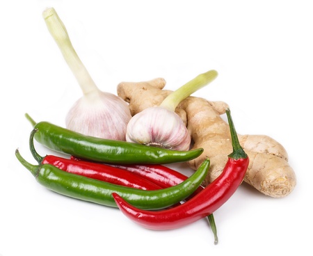 Chili, garlic and ginger root on white backgroundの写真素材